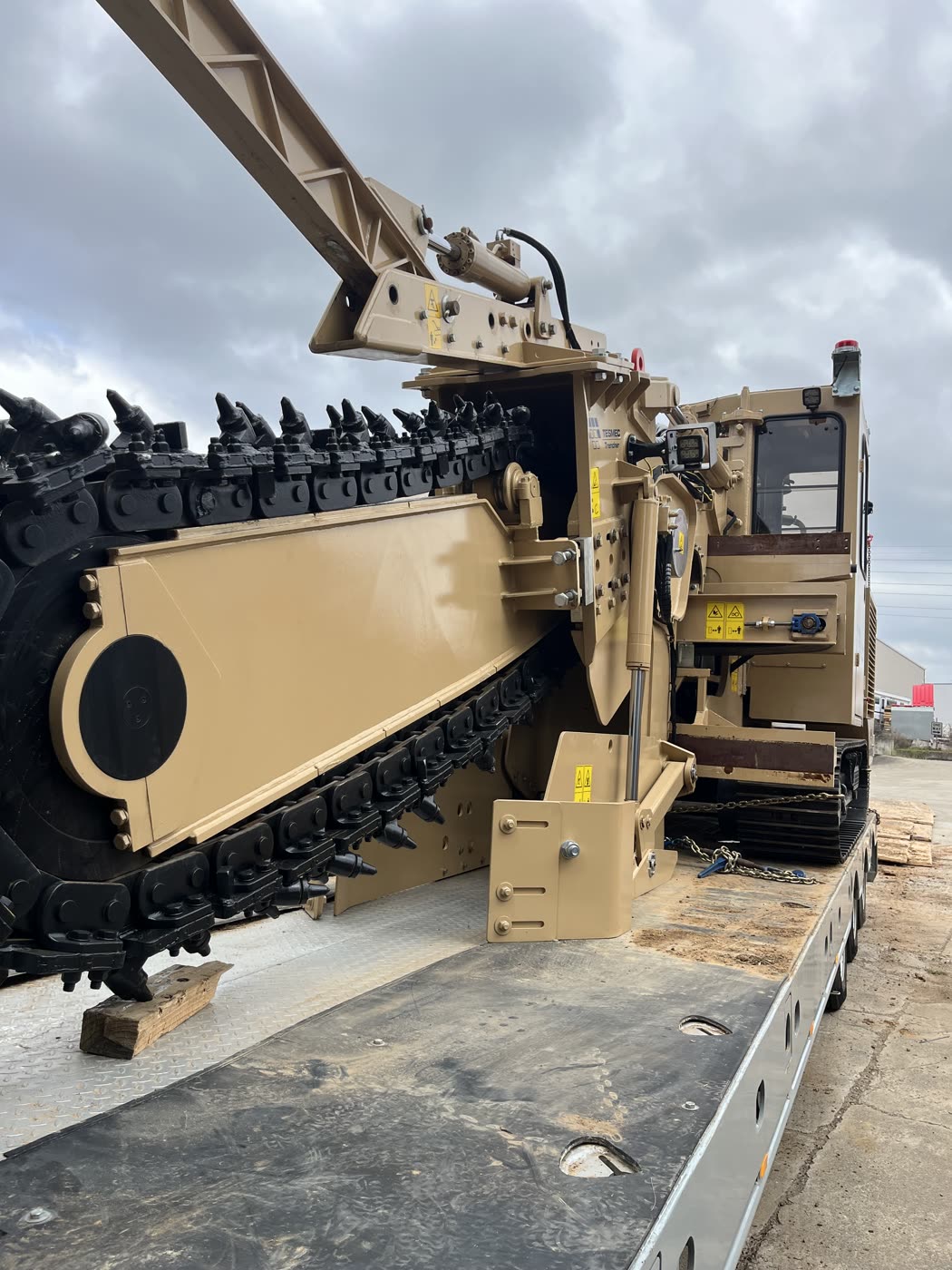 Tesmec TRS885 chain trencher loaded and chained down on the equipment float, ready to mobilise